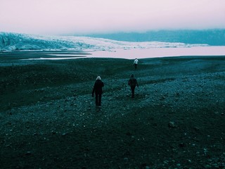 Hikers walking towards the Skaftafell glacier in Iceland
