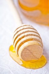 honey on wooden honey dipper