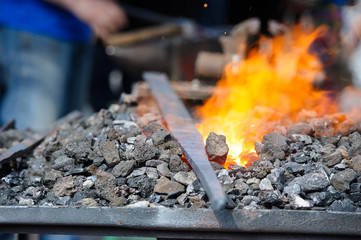 Old fashioned blacksmith furnace with burning coals