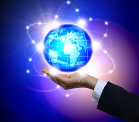Man holding a glowing earth globe in his hands