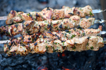 Juicy slices of meat prepare on fire