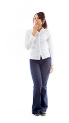 Indian young woman yawning with hand over mouth