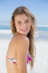 Beautiful happy blonde on the beach