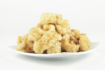 Pork rinds also known as chicharon or chicharrones, deep fried p