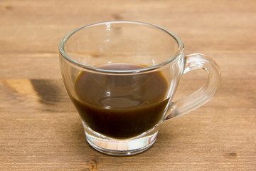 Cup of coffee on wood