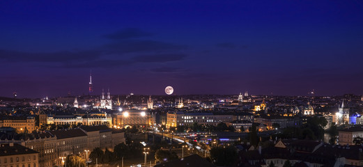 Full moon over city, Prague at night, Czech republic.