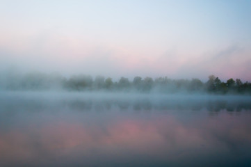 Fototapeta na wymiar Sunrise over the lake with reflection 
