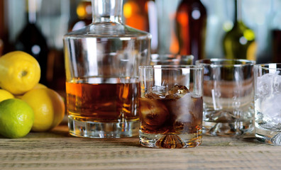 Decanter and glass of whisky with ice