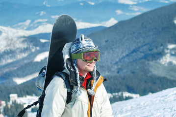 Portrait of snowboardr in the mountains