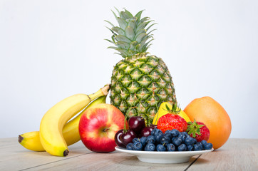 Blueberries, strawberries, cherries , bananas, pineapple