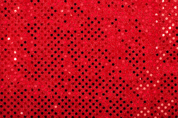 Red sequins pattern. Sparkling sequins background.