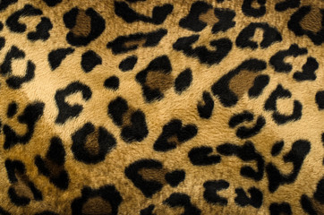 Brown and black leopard pattern. Fur animal print as background.