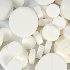 Tablets close up. A medical background