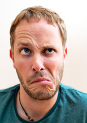 young man making grimace