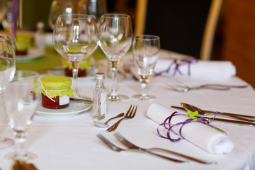 Elegant table set in lilac and green for wedding or event party