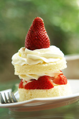 close up strawberry cake in white dish