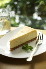 close up lemon cheese cake in white dish