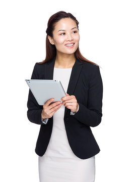 Business woman with digital tablet and look away