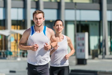 Fototapeta na wymiar Competing - jogging in two