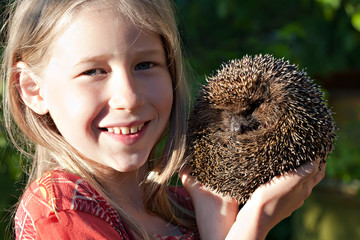 little girl with cute hedgehog