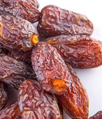 Date fruits over white background