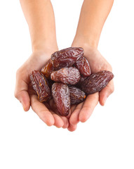 Female hands with date fruits over white background