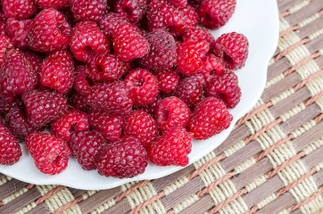 raspberry in a plate on a table