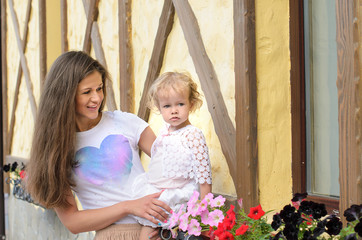 Mama and her little daughter walking