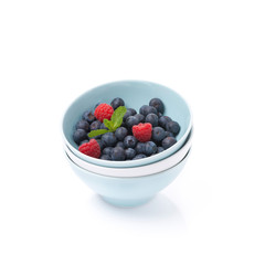 different bowls clean and fresh berries, isolated