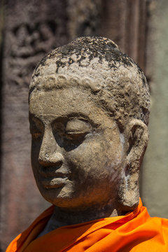 Statue in Yellow Robe at Angkor Wat Bayon Temples
