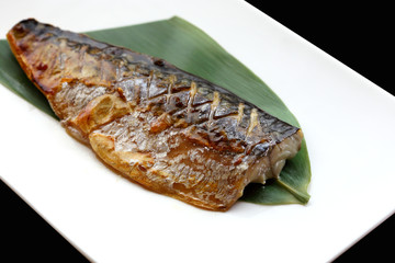 japanese cuisine saba fish grilled with sauce in the white plate