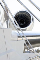 Stairs with jet engine on a private airplane - Bombardier