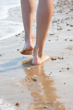 woman walking on the sand beach