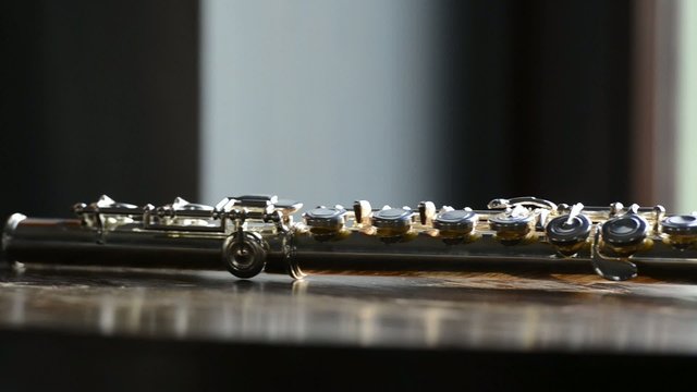 Detail of flute on a wooden table