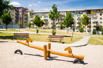 Children playground in front of row of block of flats