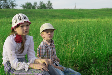 Children rest in nature on the lake in summer