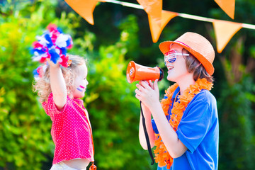 Two beautiful kids Dutch football supporters