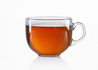 Glass cup of black tea on white background