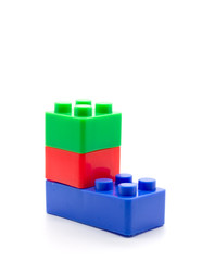 Plastic building blocks on white background