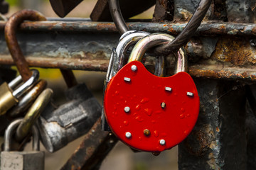 Closed padlock on the metal bridge.