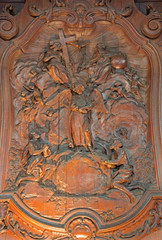 Mechelen - relief of two slaves with the angel in Janskerk