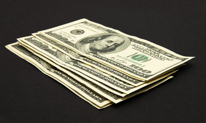 Dollars banknotes isolated on black background.