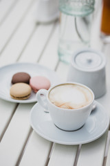 breakfast with cheesecakes, toast, cappuccino and macarons
