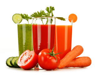 Glasses with fresh vegetable juices isolated on white