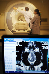 veterinarian doctor working in MRI room with moniter foreground