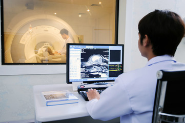 veterinarian doctor working in MRI computer control room