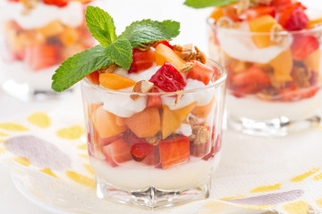 dessert with fresh strawberries, apricots and cream