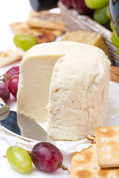 fresh cheese, crackers and fruit, close-up