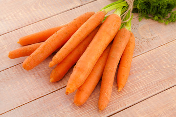 Fresh organic carrots with their tops
