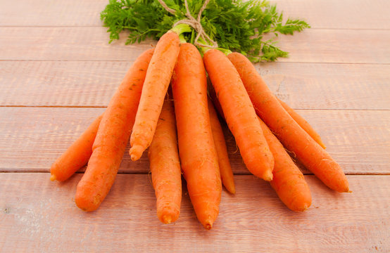 Fresh organic carrots with their tops